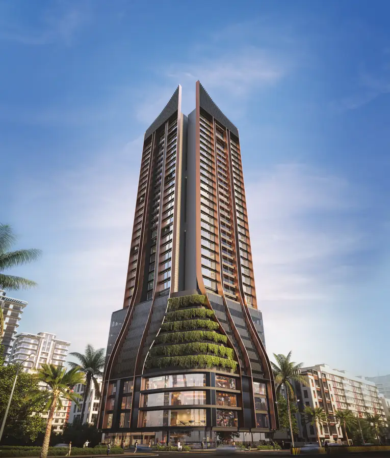 Ambit Iconia tower rising above palm trees in daylight